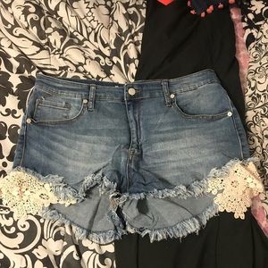 Jean shorts with lace on the side. Size 14.